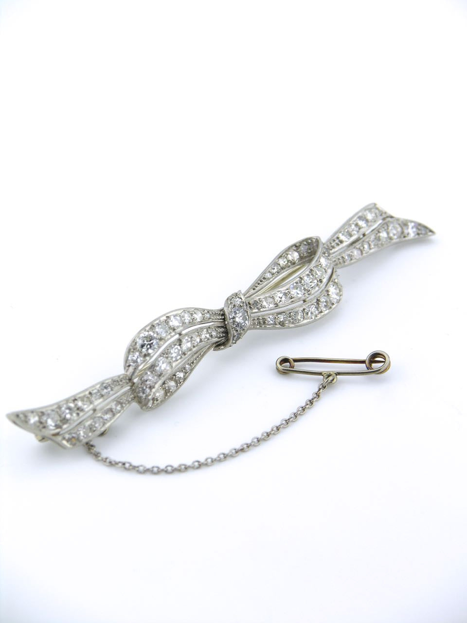 An Antique platinum and diamond Art Deco bow brooch 1930s
