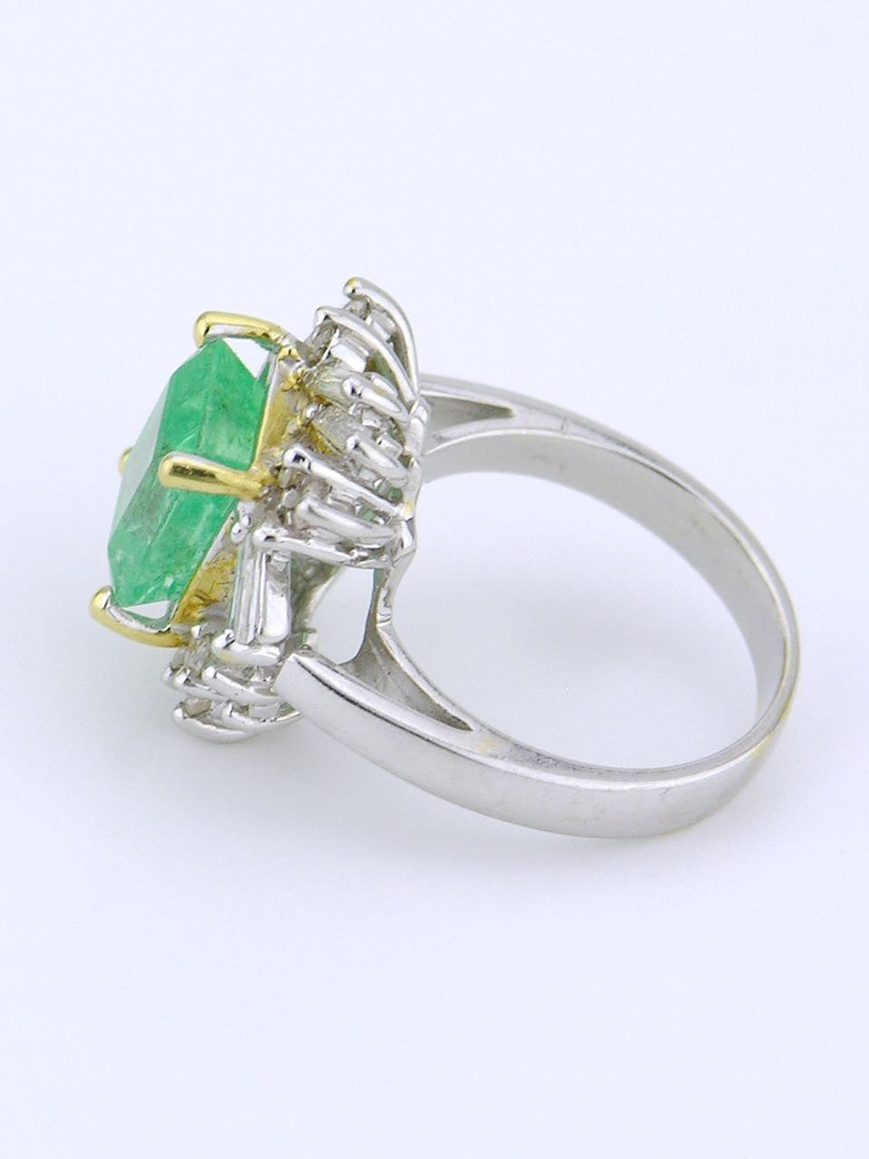 White gold emerald and diamond cluster ring
