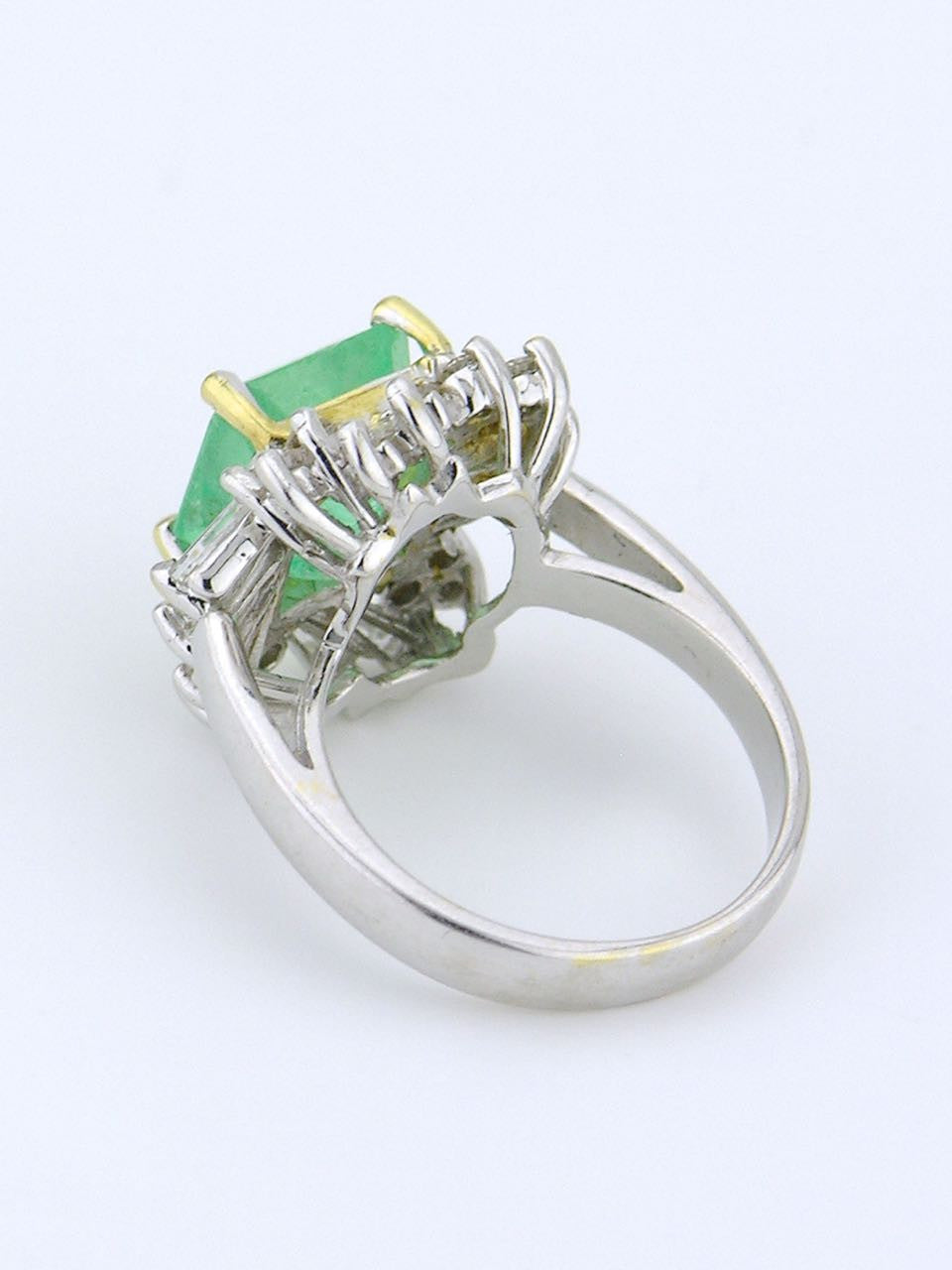 White gold emerald and diamond cluster ring