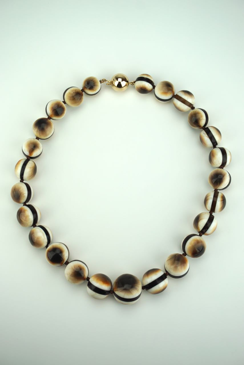 Operculum and tortoiseshell beads