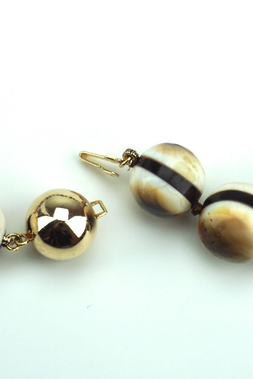 Operculum and tortoiseshell beads