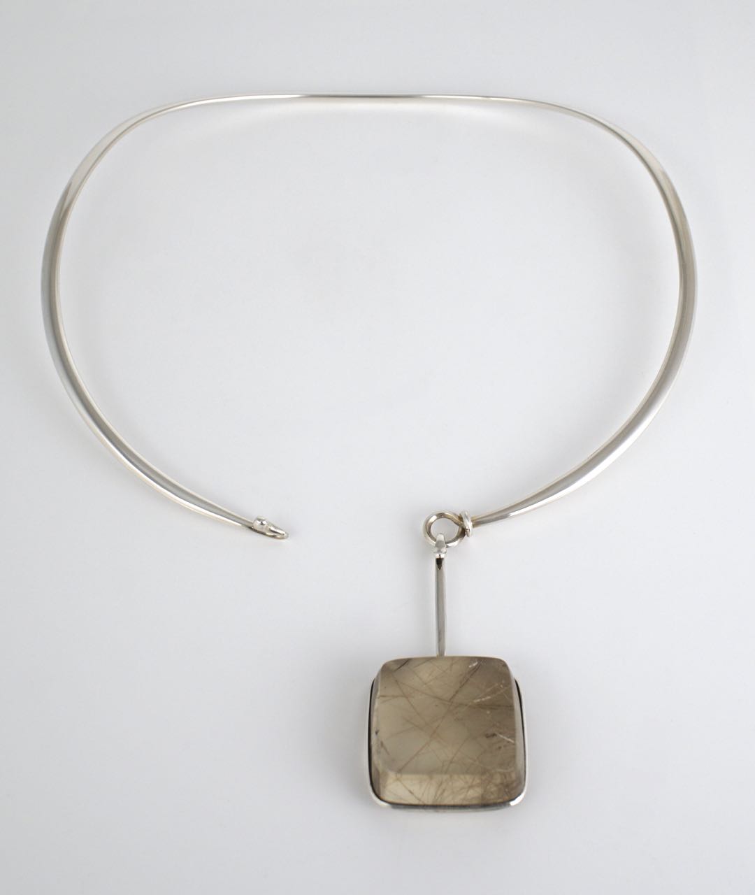Georg Jensen silver neck ring and rutilated quartz pendant design 410 Torun