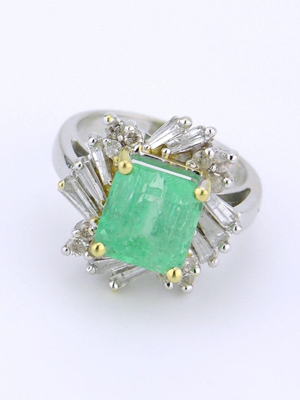 White gold emerald and diamond cluster ring