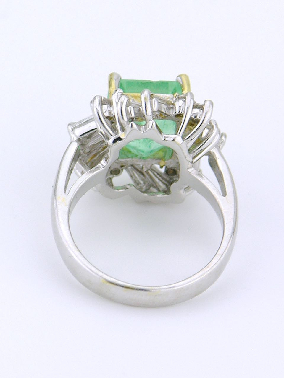 White gold emerald and diamond cluster ring